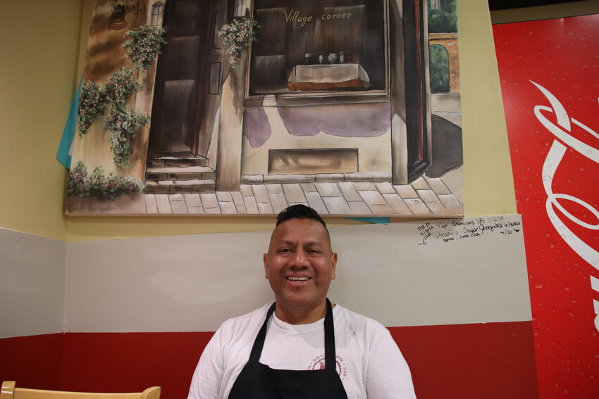 Javier Cruz, owner of Garibaldi Mexican Bistro, sits at the restaurant on Sept. 6 in Englewood. Cruz emphasized what he says is the unique nature of his menu compared to other Mexican restaurants.